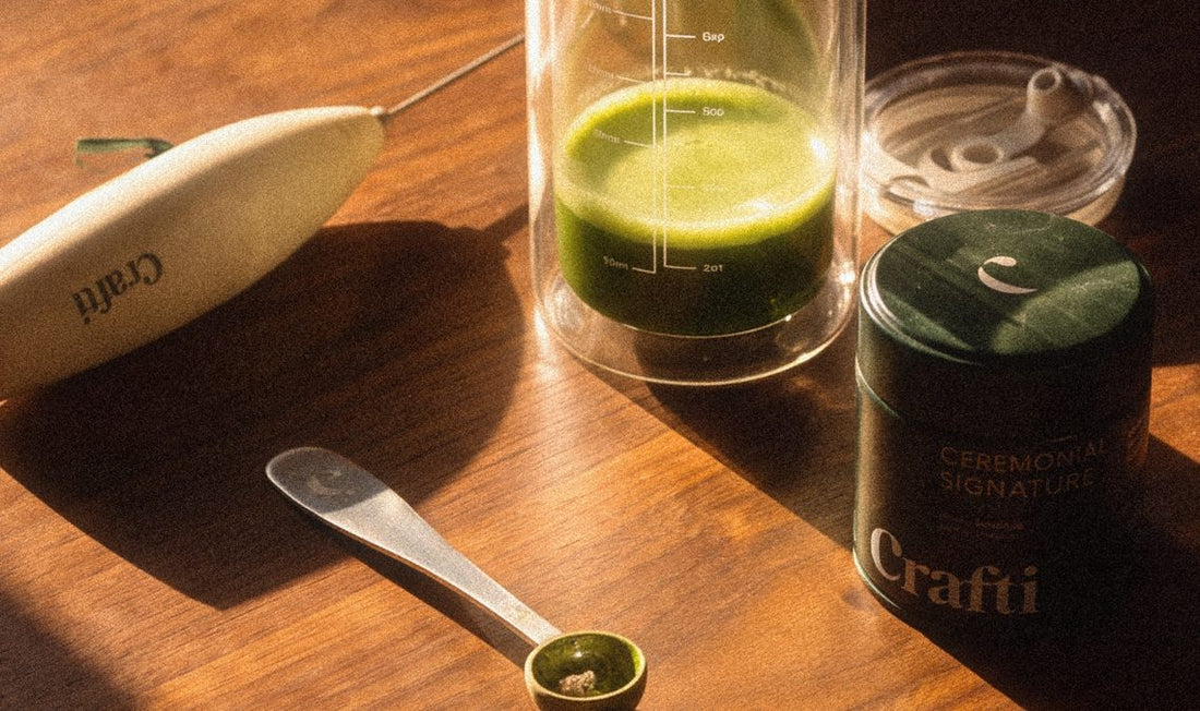 Crafti Super Frother, Slow Sippin' Tumbler, scoop and Ceremonial Signature tin on a wooden table